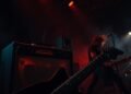 What distinguishes metal from other rock genres?